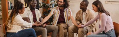 group-sitting-in-circle-holding-hands-indoors-2026-03-19-02-14-46-utc (1)