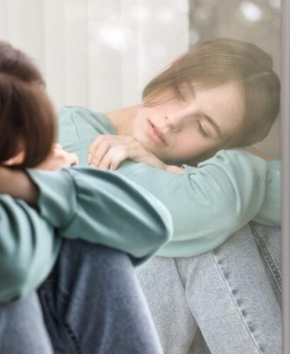 pensive-woman-leaning-on-window-in-thoughtful-mome-2026-03-25-07-00-21-utc (1)